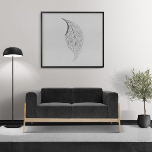 Picture frame mockup psd hanging in a modern living room